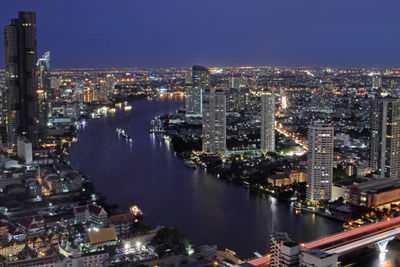 High angle view of illuminated buildings in city at night