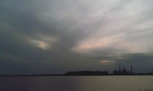 Cloudy sky above city at sunset