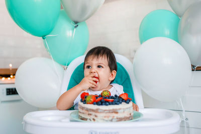 Portrait of boy with balloons