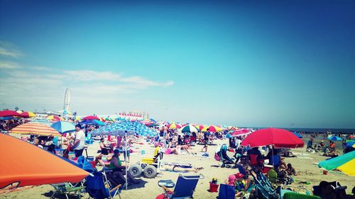 Multi colored balloons against blue sky