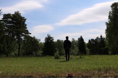 People walking on grassy field