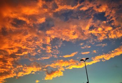 Low angle view of cloudy sky at sunset