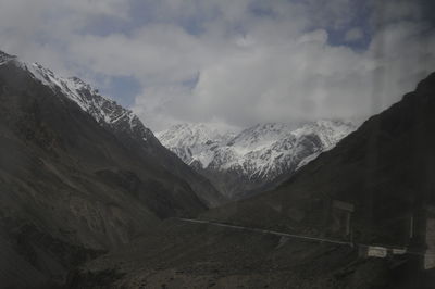 Scenic view of mountains against sky during winter