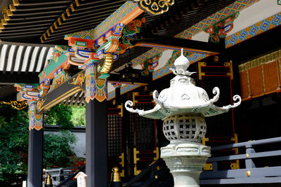 Close-up of illuminated lanterns hanging in city