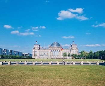 Reichstagsgebäude in germany, the capital houses on the field against the sky