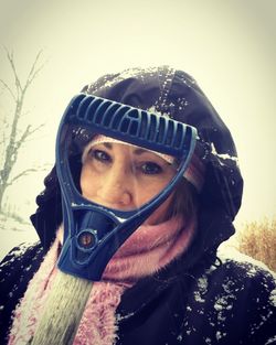 Portrait of young woman in snow