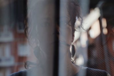 Close up of mid adult woman smoking cigarette