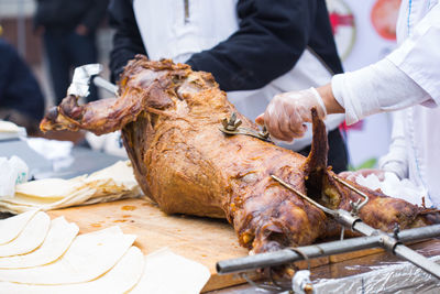 Midsection of man preparing food