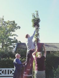 Man and woman standing against the sky