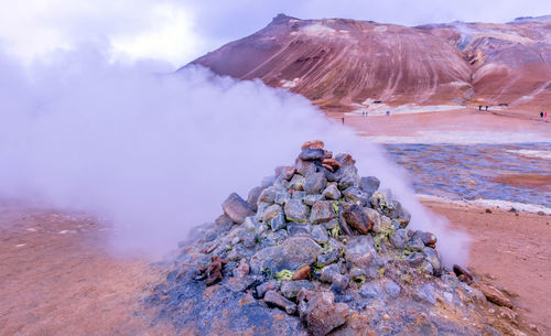 Scenic view of volcanic mountain against sky