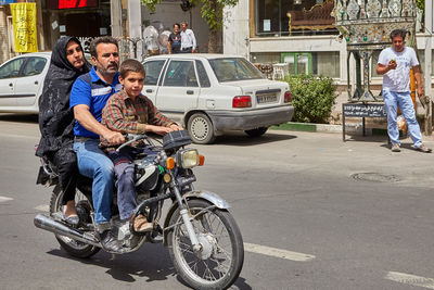 Man riding motorcycle on road