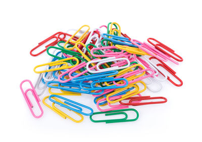 Paper clips over white background