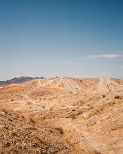 Scenic view of desert against clear sky