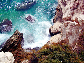 High angle view of rock formation in sea