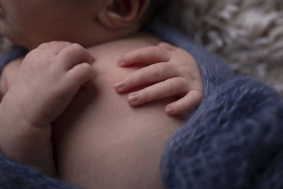 Close-up of woman touching hands