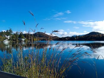 Scenic view of lake against blue sky