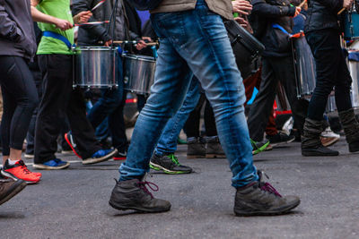 Low section of people standing on street