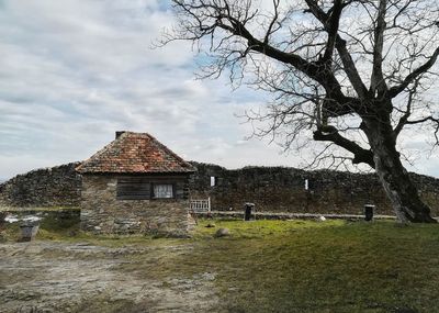 House on landscape against sky