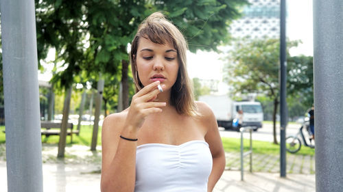 Teenage girl smoking cigarette