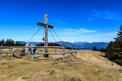 Scenic view of field against blue sky