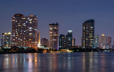 Illuminated buildings in city at night