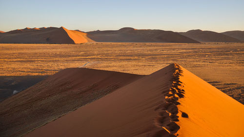 Scenic view of desert against clear sky