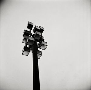 Low angle view of illuminated street light against clear sky