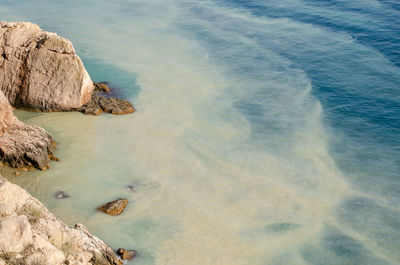 High angle view of rocks on beach