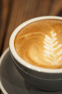 Close-up of cappuccino on table