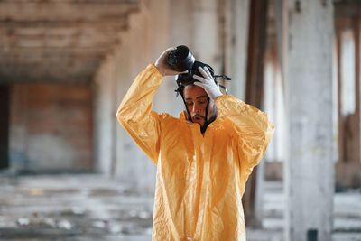 Rear view of woman wearing hat standing outdoors