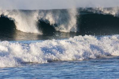 Waves on the sandy beach in hikkaduwa, sri lanka