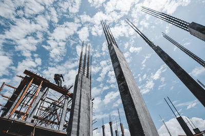 Low angle view of architectural column against sky