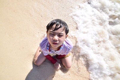 High angle portrait of woman on shore