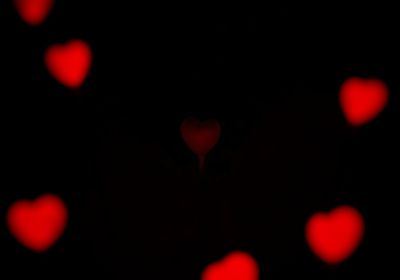 Close-up of heart shape against black background