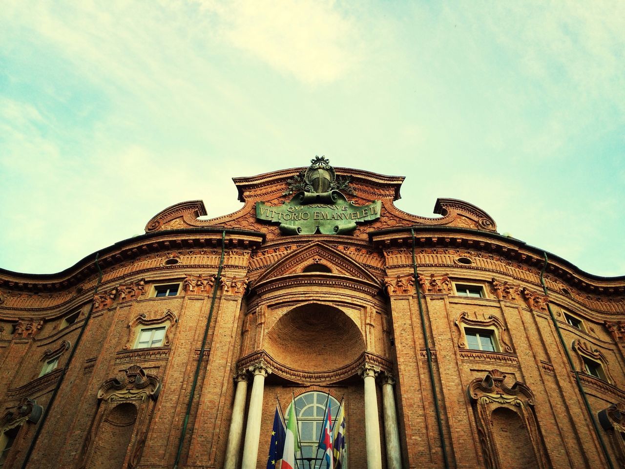 architecture, built structure, building exterior, low angle view, place of worship, sky, church, religion, arch, spirituality, history, facade, cathedral, blue, cloud - sky, day, travel destinations, cloud