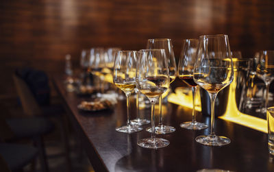 Close-up of wineglasses on table