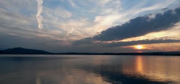 Scenic view of lake at sunset