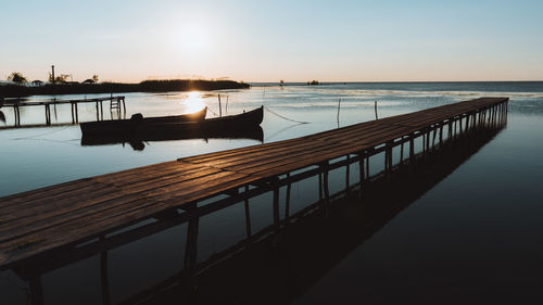 Pier over sea against sky