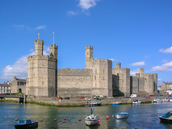 Caernarfon castle is a medieval fortress in caernarfon, gwynedd, north-west wales