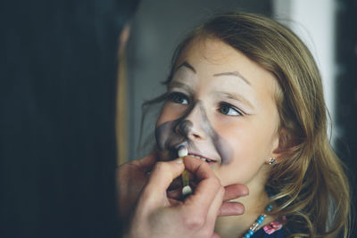 Close-up of girl wearing face paint