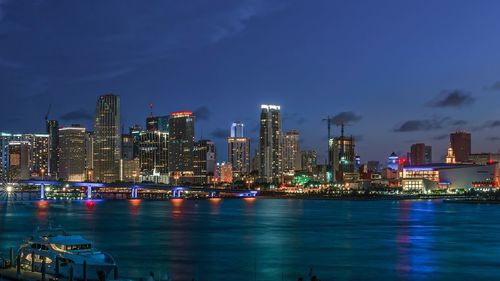 Illuminated city at waterfront