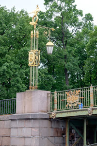 Low angle view of building and trees in park