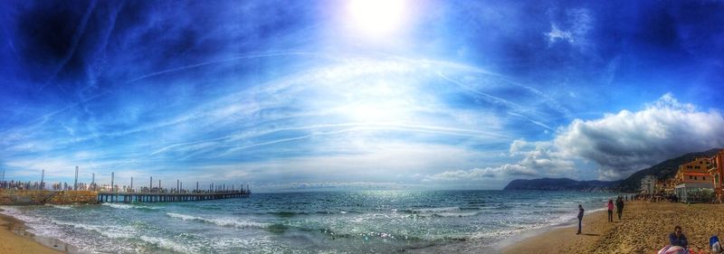 Panoramic view of beach against blue sky