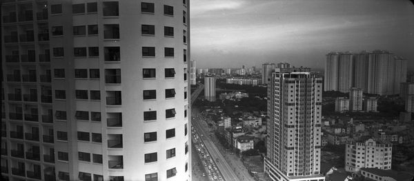 High angle view of buildings in city against sky