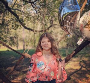 Portrait of smiling girl on tree