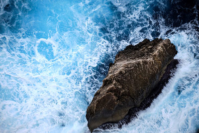 High angle view of waves in sea