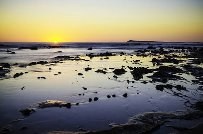 Scenic view of sea at sunset