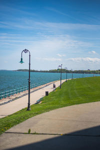 Street by sea against sky