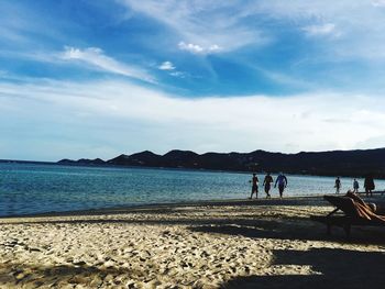 Scenic view of beach against blue sky