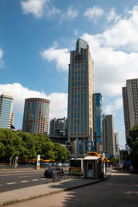 Modern buildings in city against sky